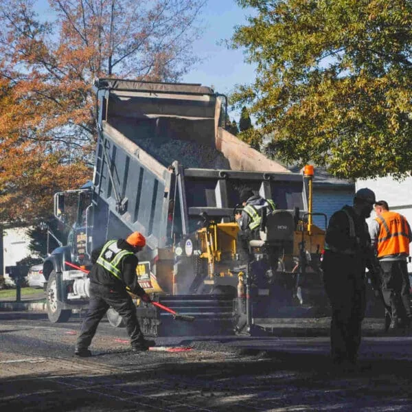 Eosso Brothers Paving Employees Resurfacing road