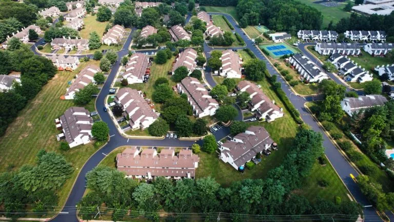 homeowners association paving company aerial view of asphalt paving, repaving, and sealcoating on community roads